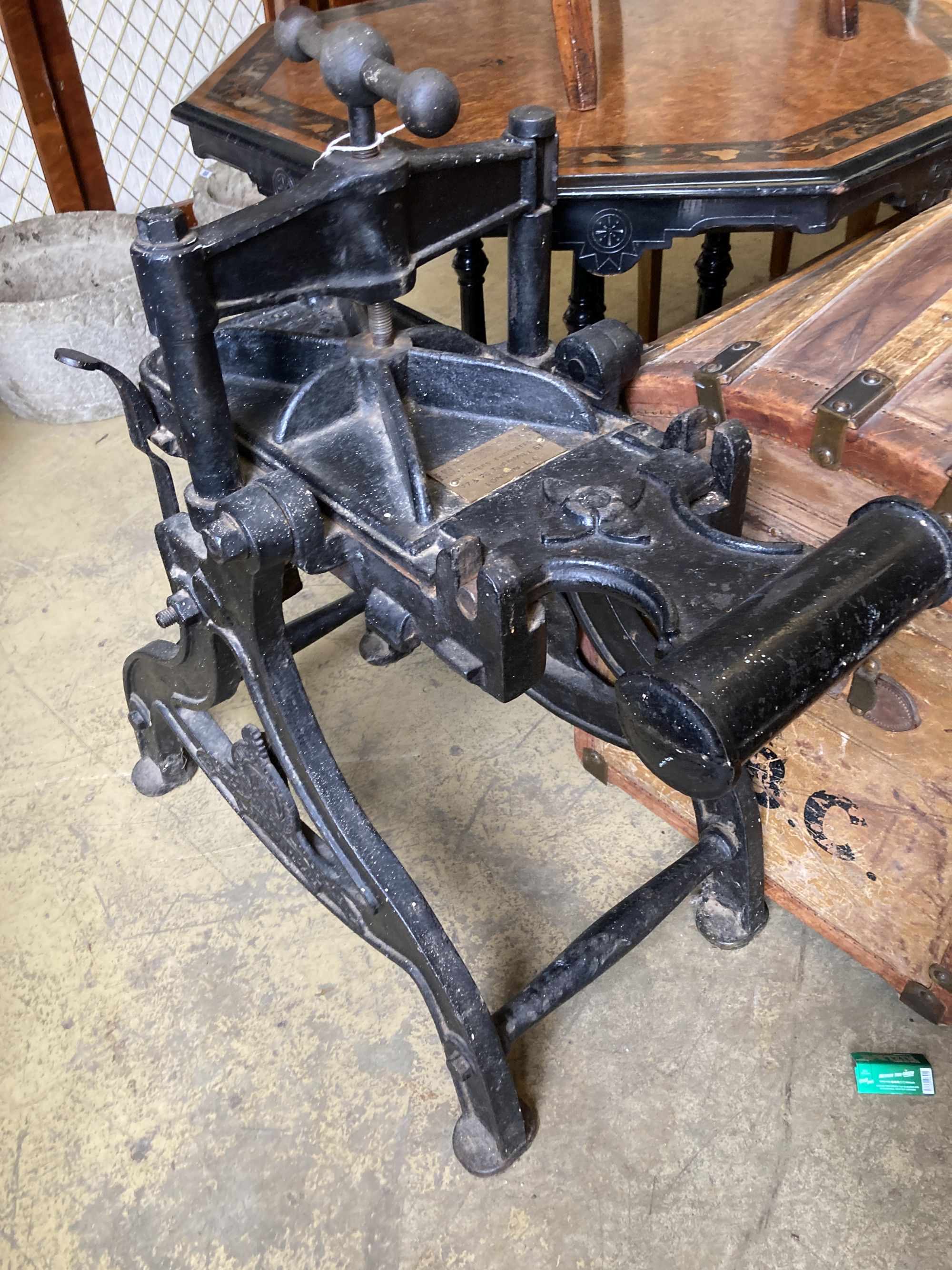 A Harrild and Sons cast iron lithographic press, with later brass plaque - F.W. Woodruff & Co. Ltd., width 44cm, depth 74cm, height 86c